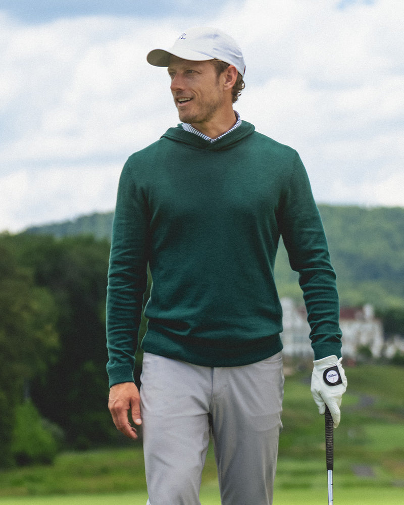 A man wearing a Rhoback sweater